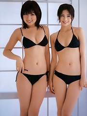 Two alluring gravure idol beauties showing off in their bikini